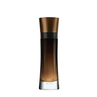 Perfume bottle with brown and gold design on a white background