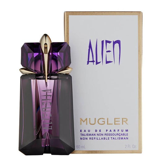 Mugler Alien Eau de Parfum bottle with a faceted purple crystal design and gold cap, shown next to its white and gold packaging box featuring the purple Alien logo.