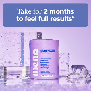 A lavender supplement bottle labeled 'meno MENOPAUSE Vitamin Capsules' by OPositiv Health, shown on a reflective surface with ice cubes and a purple text banner at the top reading 'Take for 2 months to feel full results*'.