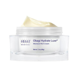 A jar of Obagi Medical Obagi Hydrate Luxe Moisture-Rich Cream with a swirl of pale yellow cream visible at the top, set against a plain white background.