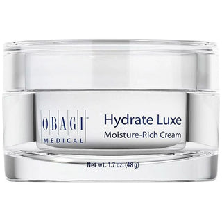 A clear cosmetic jar of Obagi Medical Hydrate Luxe Moisture-Rich Cream with a white label and silver-toned base, shown on a white background.