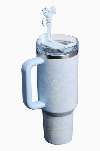 Blue insulated tumbler with handle and straw on a white background